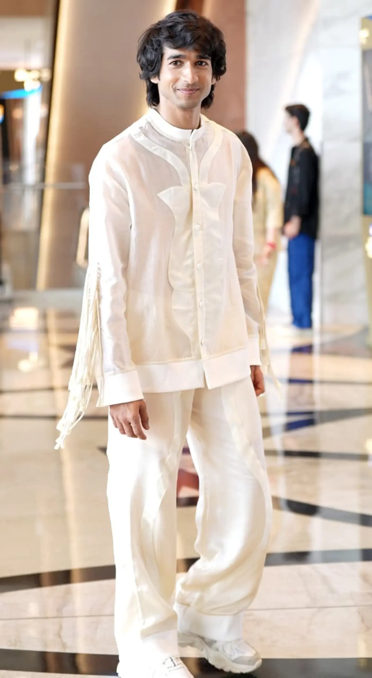 Shantanu Maheshwari keeps it effortlessly stylish at Lakme Fashion Week in an all-white ensemble. The relaxed silhouette paired with subtle detailing and fringed accents adds a contemporary edge.